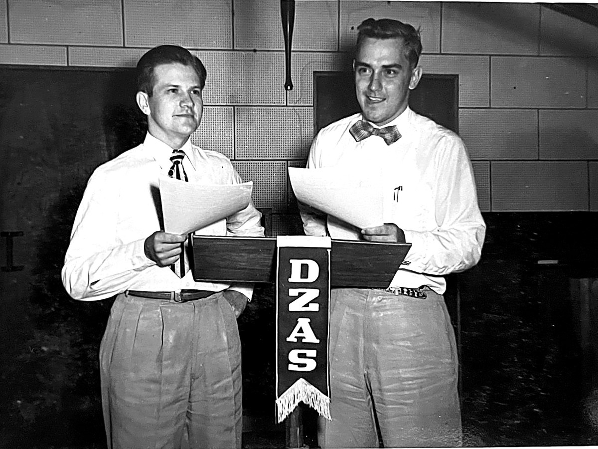 Ken Engle and Ken Brooks at the DZAS microphone stand in Manila, about 1953