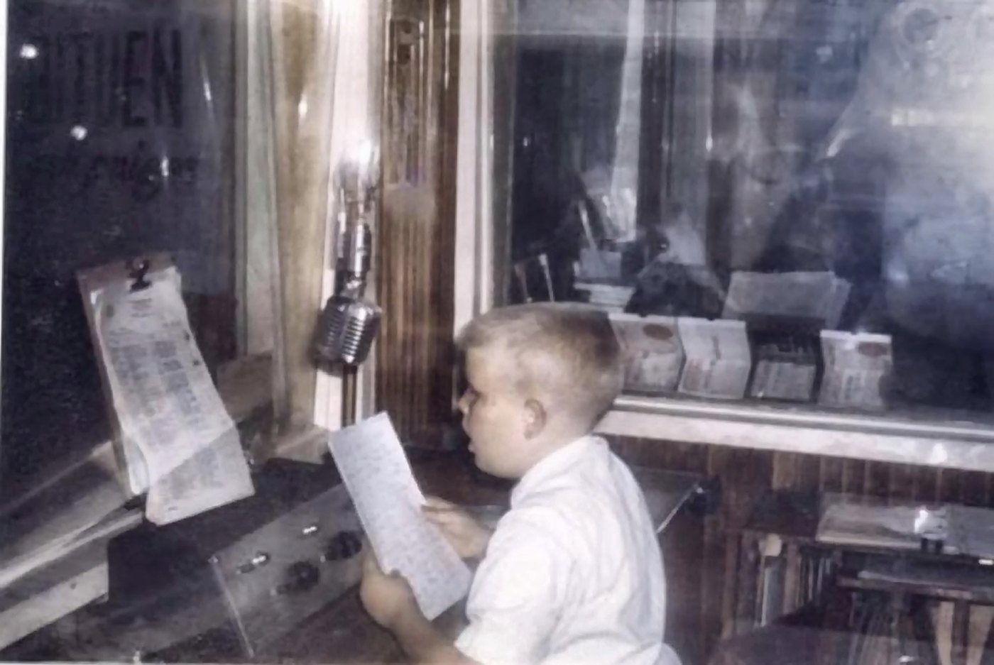 Kevin Engle, about nine years old, at a radio microphone in Baguio City
